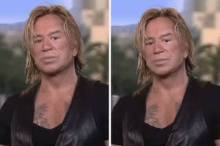 A person with styled hair and a leather vest poses for a portrait, displaying a chest tattoo. The background appears blurred