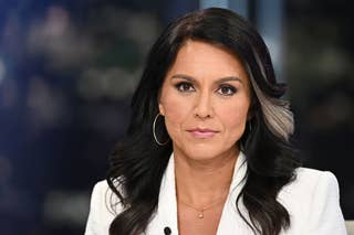 Tulsi and Trump A red arrow points to the person on the left with bold text overlay