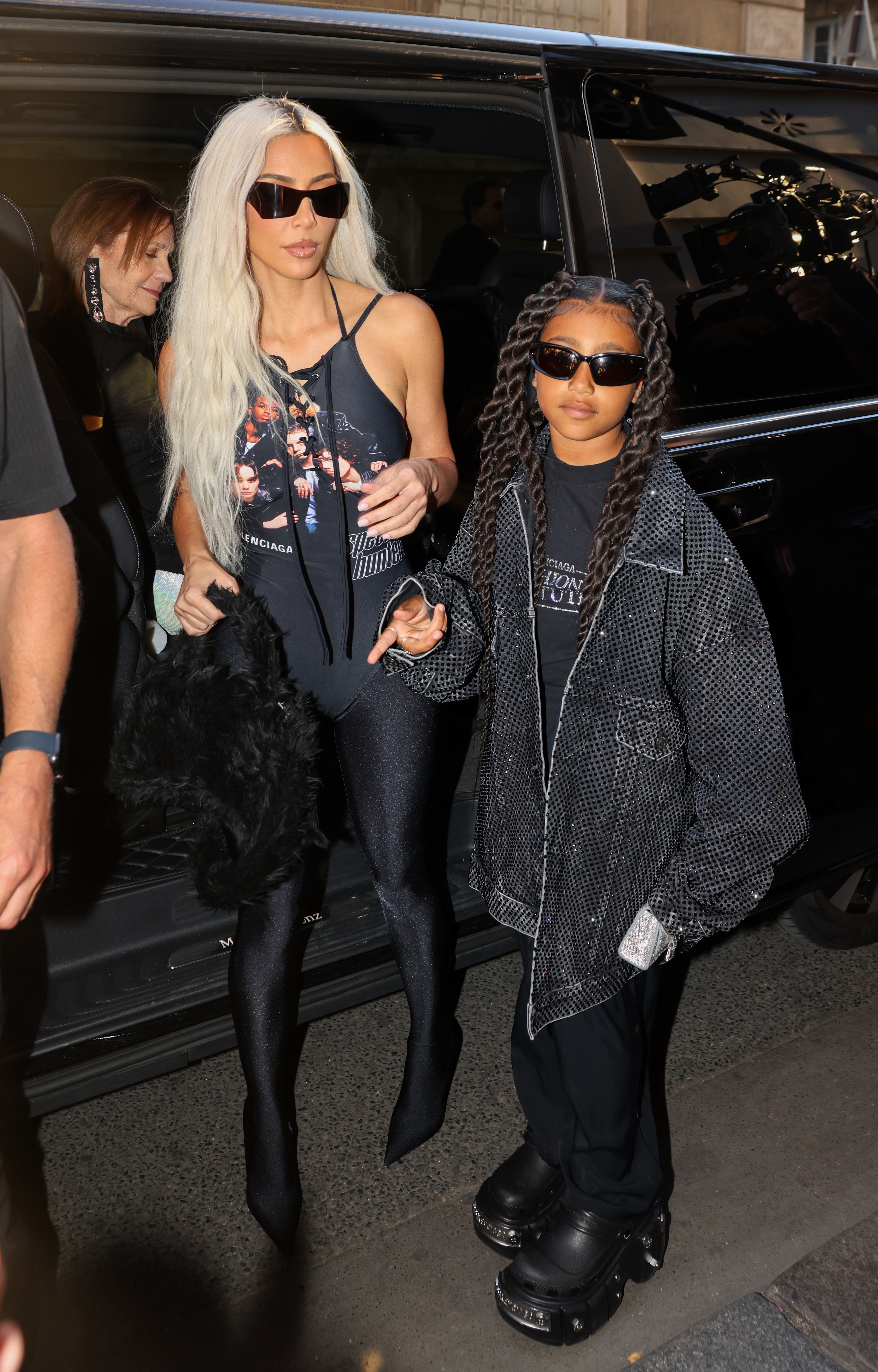 Kim and North exiting a vehicle at night